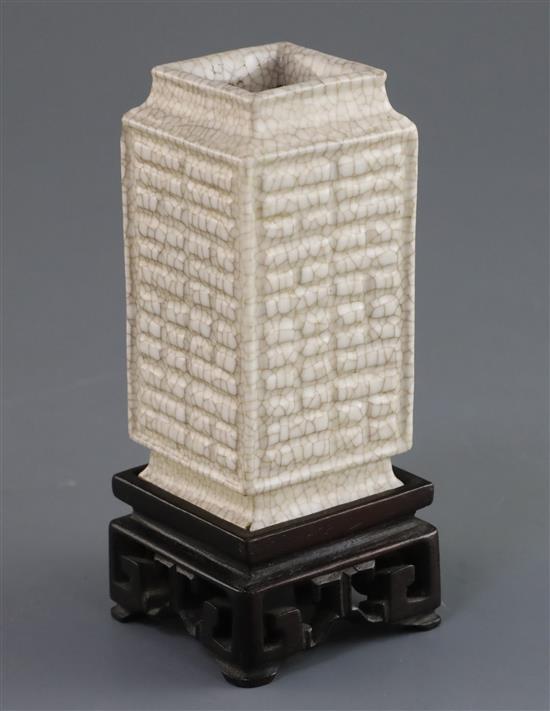 A Chinese Ge-type eight trigrams cong vase, Qianlong moulded seal mark, 19th/20th century, H. 9cm, chip to shoulder, wood stand